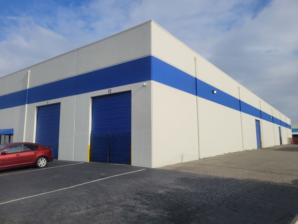 Warehouse Exterior painted by Wall 2 Wall Painting