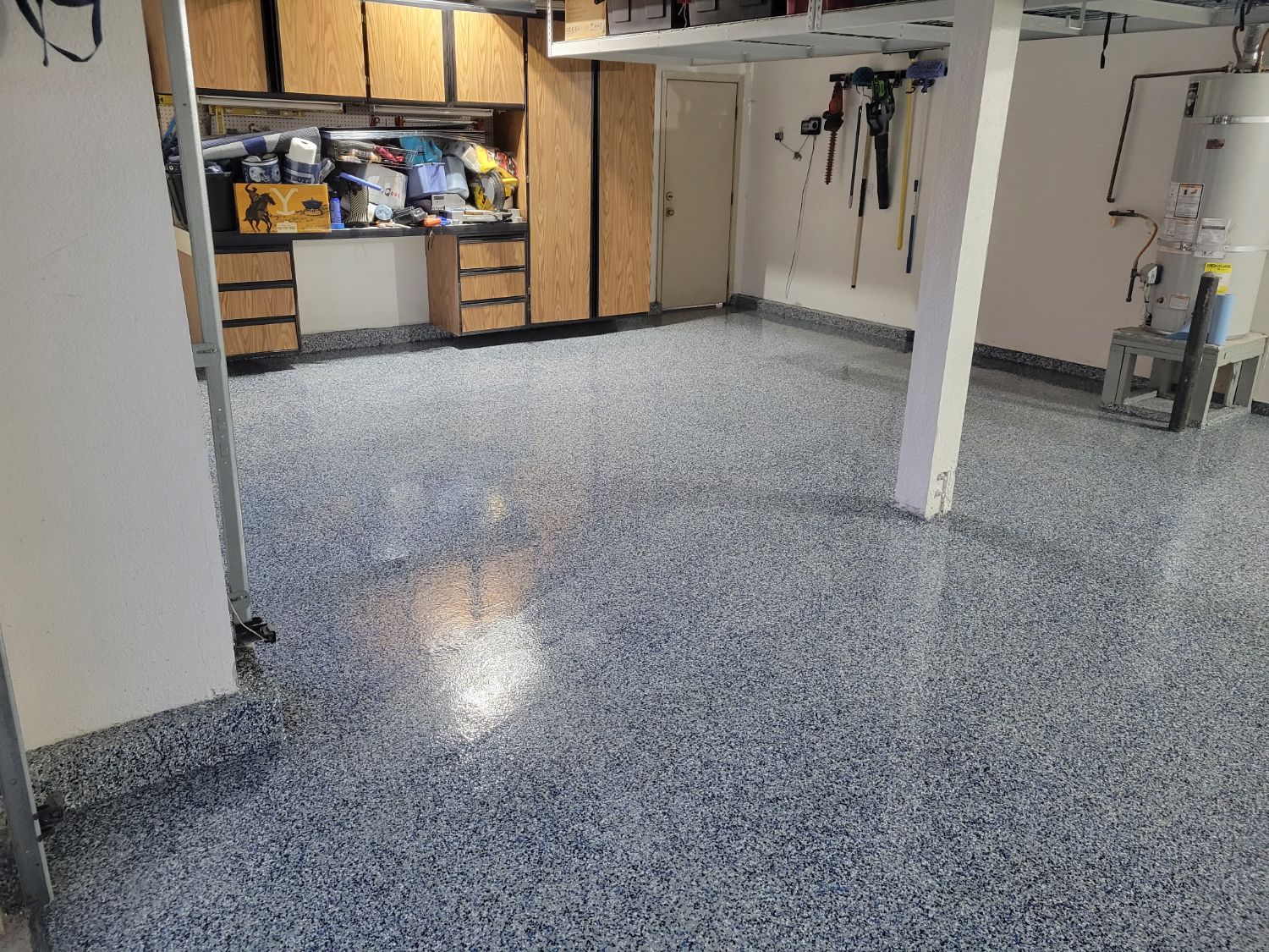 Garage floor with a blue and gray flake epoxy coating