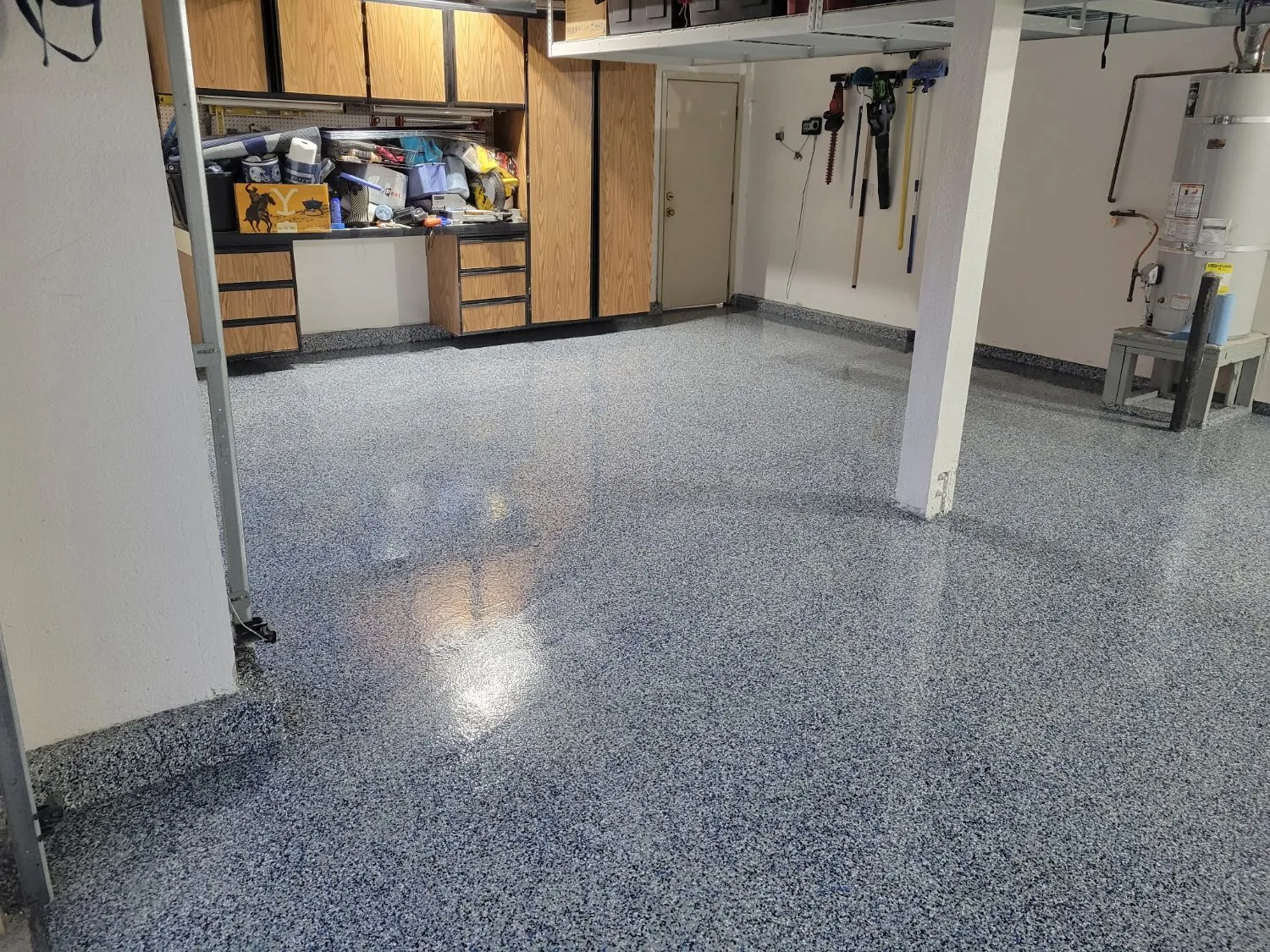 Garage floor with a blue and gray flake epoxy coating