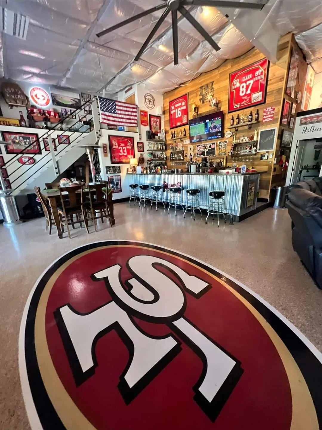 Custom team logo epoxy floor installed by Wall 2 Wall Painting